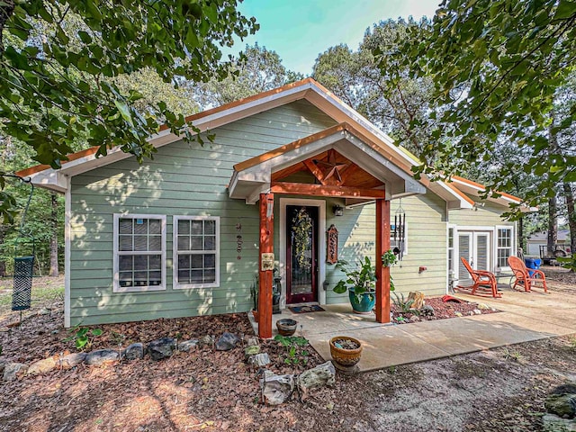 bungalow-style home featuring a patio