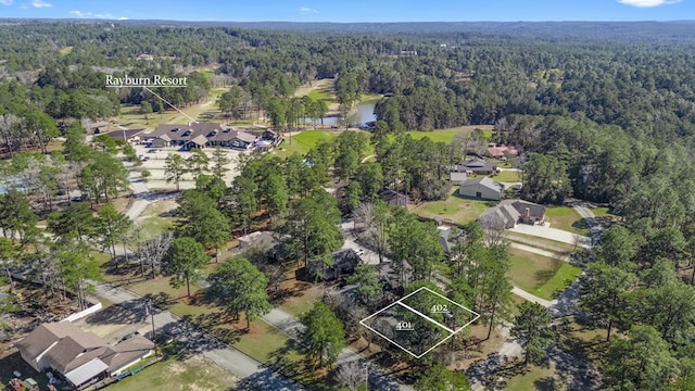 aerial view with a water view, a forest view, and a residential view