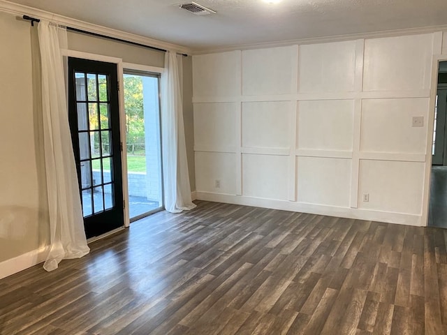 spare room featuring dark hardwood / wood-style flooring