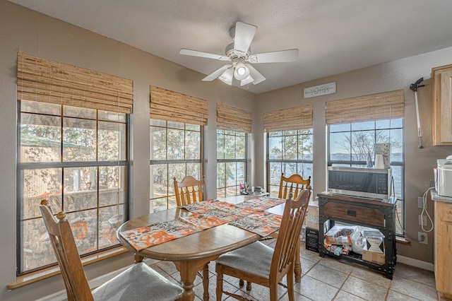 1500 New Haven Rd, Hemphill, TX 75948 - tiled dining room featuring a textured ceiling and ceiling fan