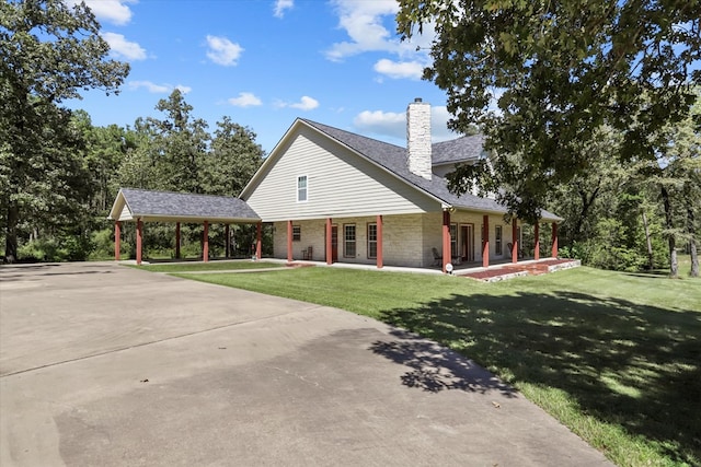 view of front of property with a front yard and covered porch