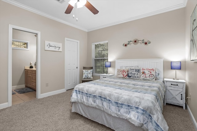 carpeted bedroom featuring ceiling fan, ornamental molding, and ensuite bathroom