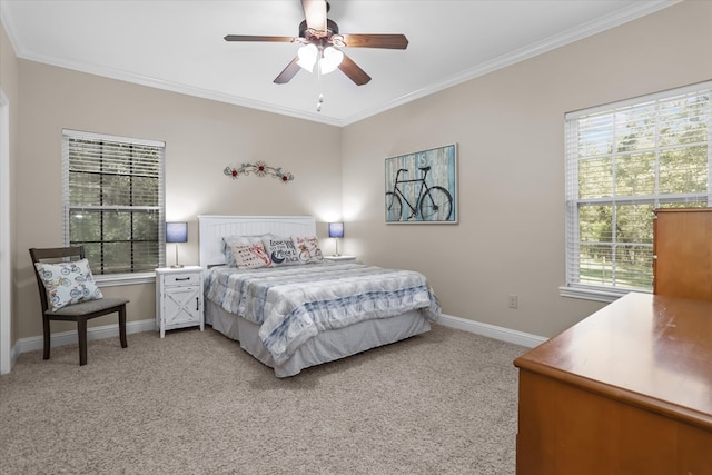 bedroom featuring ceiling fan, light colored carpet, and ornamental molding