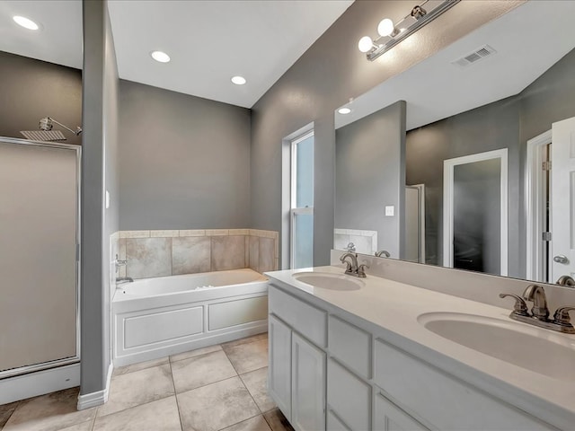 bathroom featuring tile patterned floors, plus walk in shower, and vanity