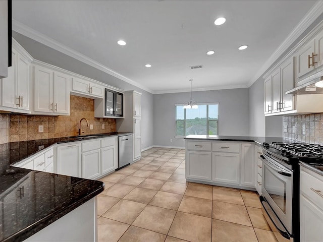 kitchen with white cabinets, light tile patterned flooring, and appliances with stainless steel finishes