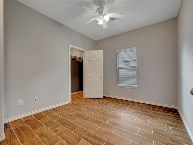 unfurnished bedroom with a closet, light hardwood / wood-style flooring, and ceiling fan