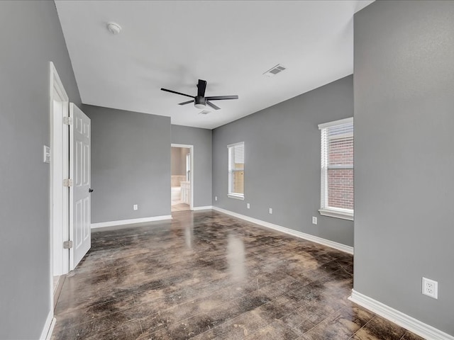 unfurnished room with dark hardwood / wood-style floors and ceiling fan