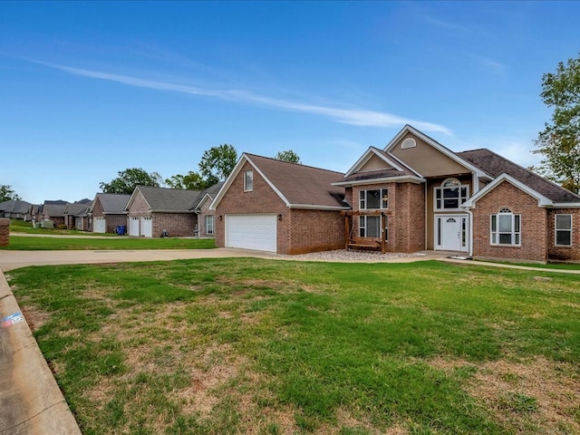 view of front facade with a garage and a front lawn