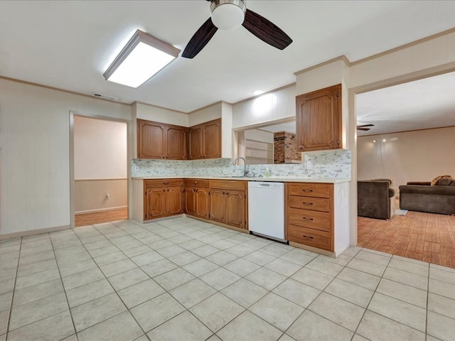 kitchen featuring ornamental molding, white dishwasher, ceiling fan, sink, and light tile patterned flooring