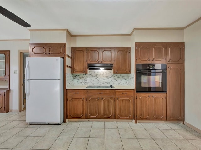 kitchen with decorative backsplash, crown molding, and black appliances