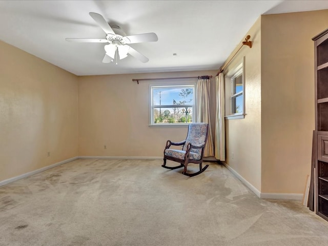 unfurnished room with light carpet and ceiling fan