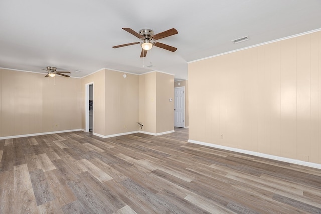 unfurnished room featuring crown molding, ceiling fan, and light hardwood / wood-style flooring