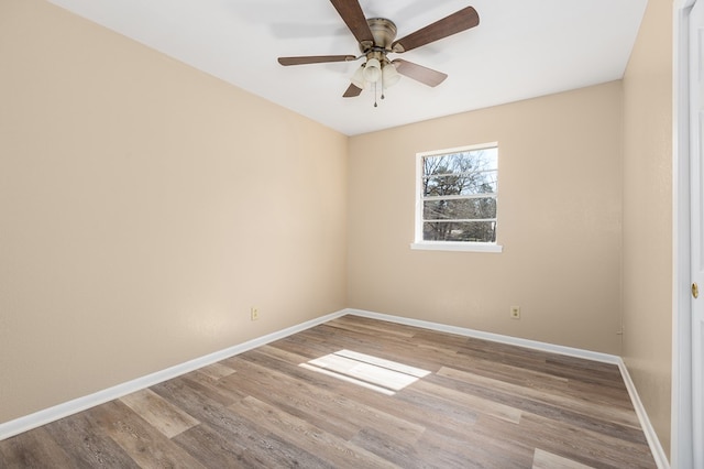 empty room with light hardwood / wood-style flooring and ceiling fan