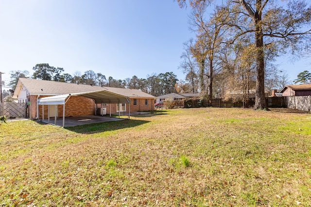 view of yard with a carport