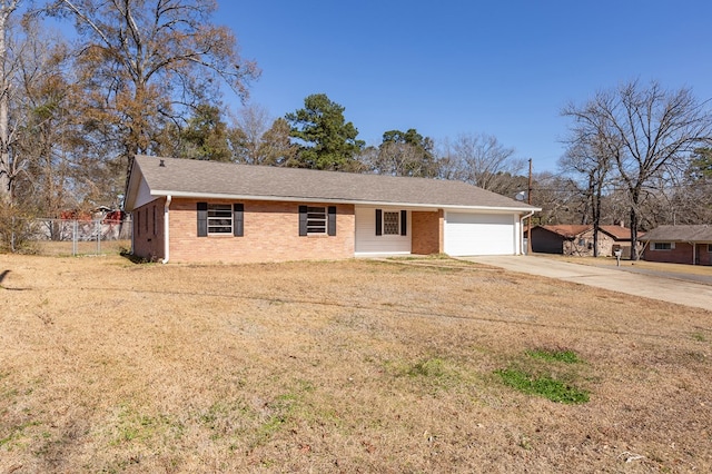 view of front of house with a garage and a front lawn