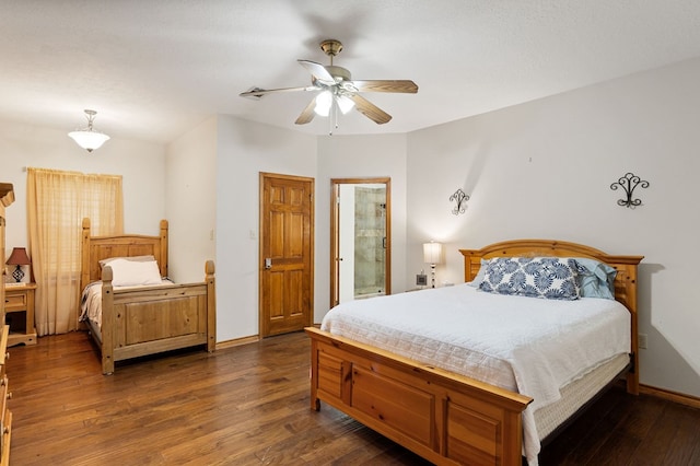 bedroom featuring ceiling fan and dark wood-type flooring