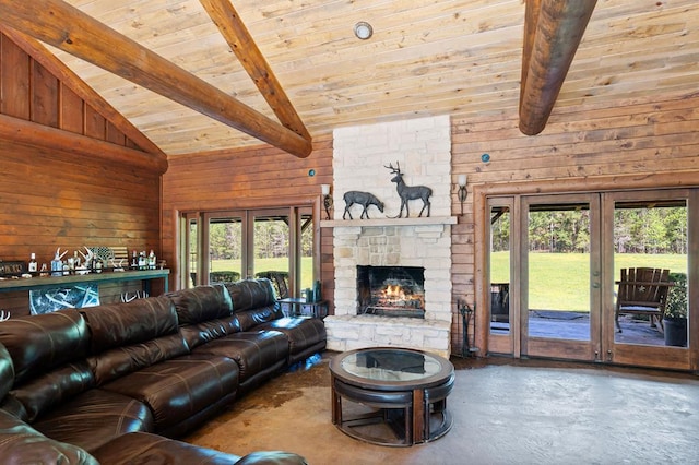 unfurnished living room with beam ceiling, wood walls, french doors, and high vaulted ceiling