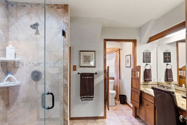 bathroom featuring vanity, toilet, and walk in shower