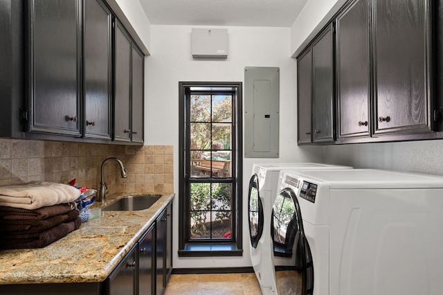 laundry area with cabinets, electric panel, sink, washer and dryer, and light tile patterned floors