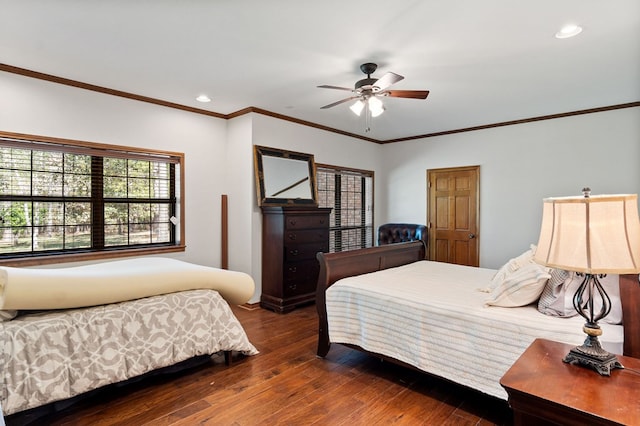 bedroom featuring ceiling fan, ornamental molding, and dark wood-type flooring