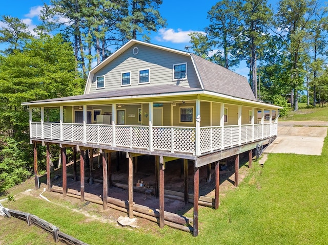 264 Wildbriar Dr, Jasper, TX 75951 - rear view of property with a gambrel roof, a lawn, and roof with shingles