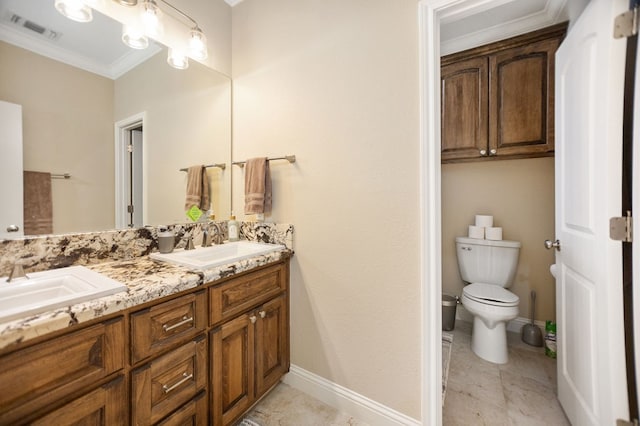 full bath with visible vents, toilet, ornamental molding, and a sink