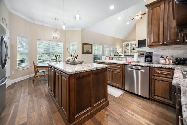 kitchen with ceiling fan, appliances with stainless steel finishes, a sink, and dark wood-style floors