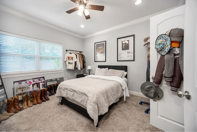 carpeted bedroom with recessed lighting, ceiling fan, baseboards, and ornamental molding