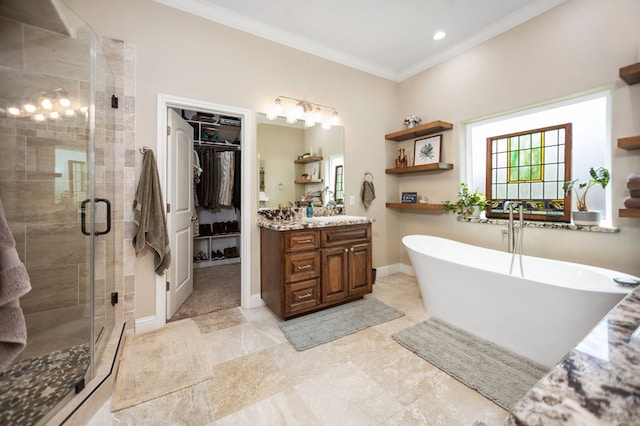 full bath with a shower stall, a freestanding bath, vanity, a walk in closet, and crown molding