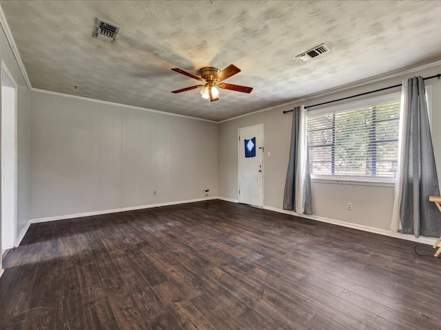 empty room with hardwood / wood-style floors, visible vents, a ceiling fan, and baseboards