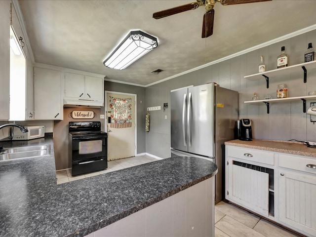 kitchen with a sink, white cabinets, light tile patterned flooring, and black range with electric cooktop