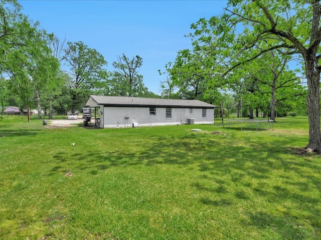 rear view of house with a yard