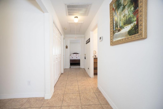 hallway with light tile patterned floors