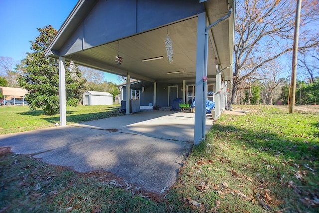 view of patio / terrace with a shed