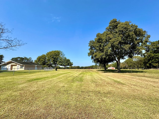 view of yard with a rural view