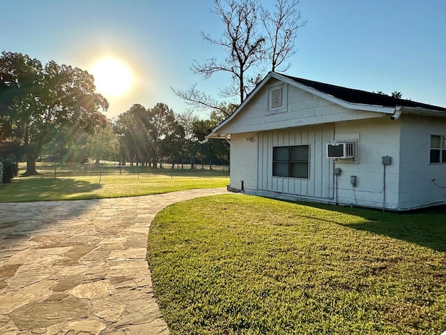 view of home's exterior with a yard