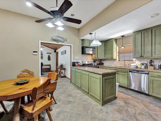 21441 Fm 705, Broaddus, TX 75929 - kitchen with green cabinetry, stainless steel appliances, and backsplash