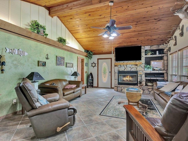 21441 Fm 705, Broaddus, TX 75929 - living area with wood ceiling, ceiling fan, a stone fireplace, high vaulted ceiling, and baseboards