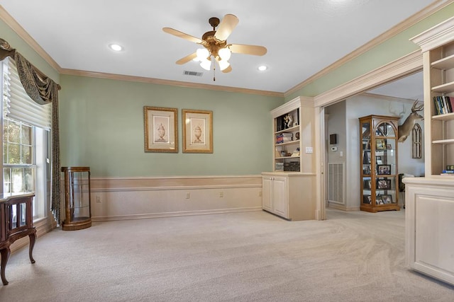 interior space featuring crown molding and ceiling fan