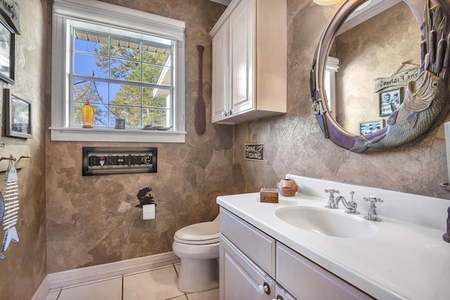 bathroom featuring tile patterned flooring, vanity, and toilet