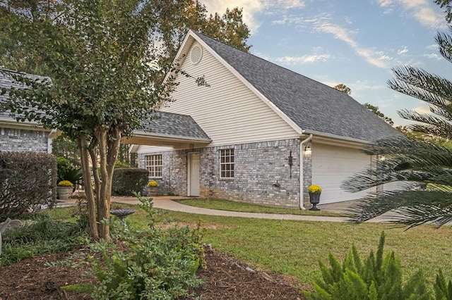 view of front facade with a garage and a front yard