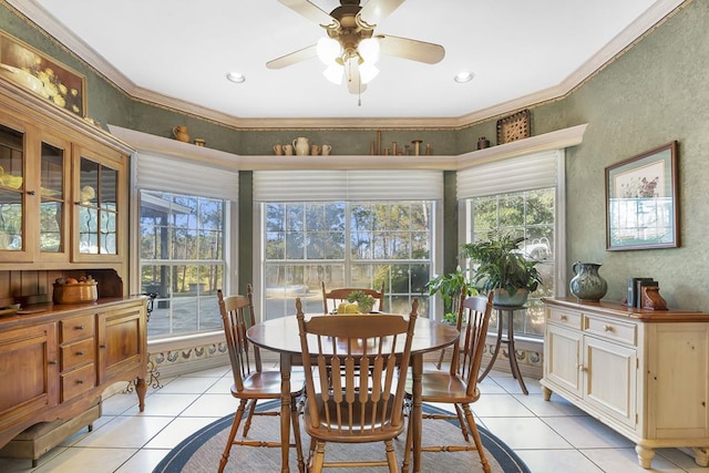 dining space featuring crown molding, light tile patterned floors, and ceiling fan