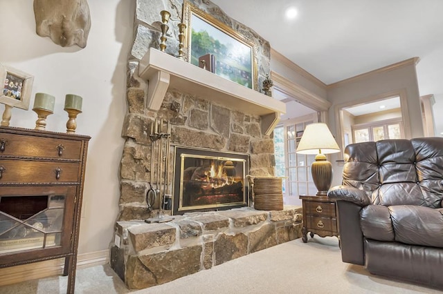 sitting room with light carpet, a fireplace, and crown molding