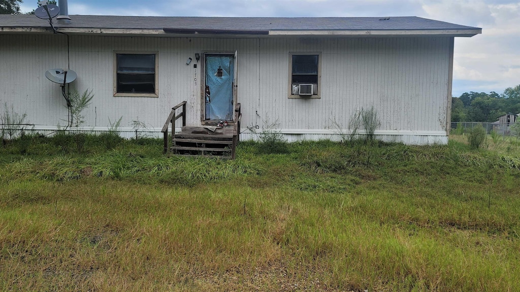 view of front of home featuring cooling unit