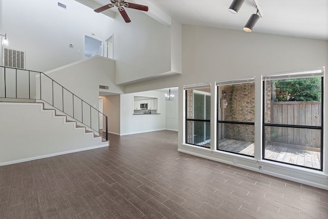 112 Westchester St, Lufkin, TX 75901 - unfurnished living room featuring high vaulted ceiling, ceiling fan, wood finished floors, stairway, and beam ceiling