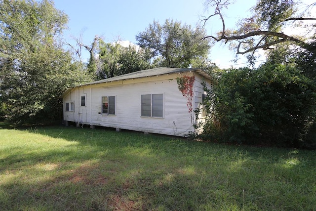 view of home's exterior featuring a yard