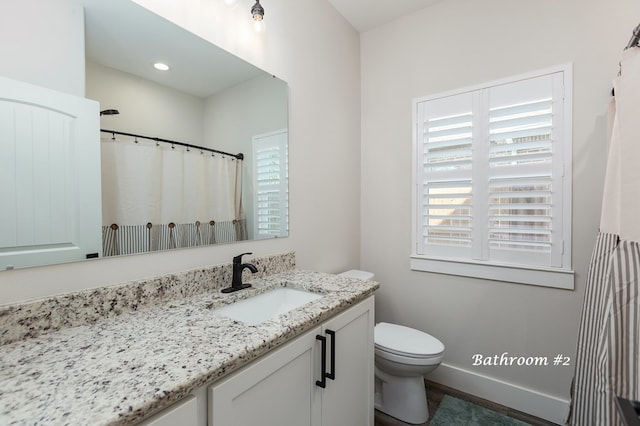 full bath with recessed lighting, toilet, vanity, and baseboards