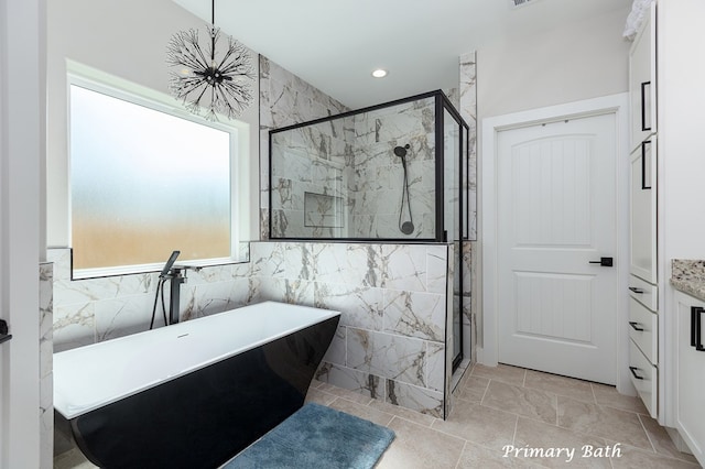 bathroom with a shower stall, recessed lighting, tile walls, and a freestanding bath