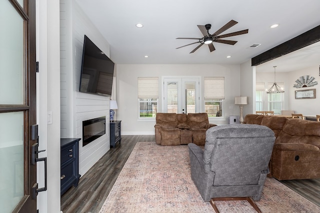 living room with recessed lighting, french doors, visible vents, and dark wood-style floors