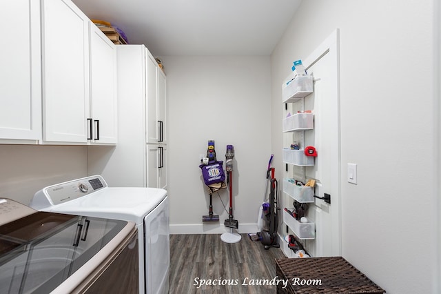 washroom with washer and dryer, baseboards, cabinet space, and dark wood finished floors